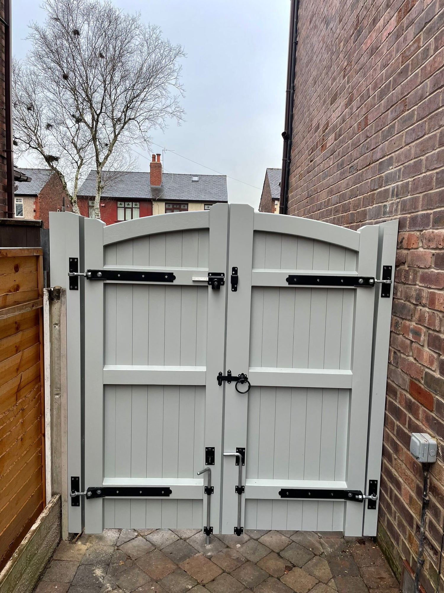 The back of a hardwood grey double gate