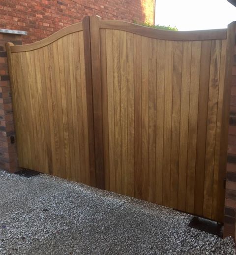 Iroko hardwood driveway gates swan neck design
