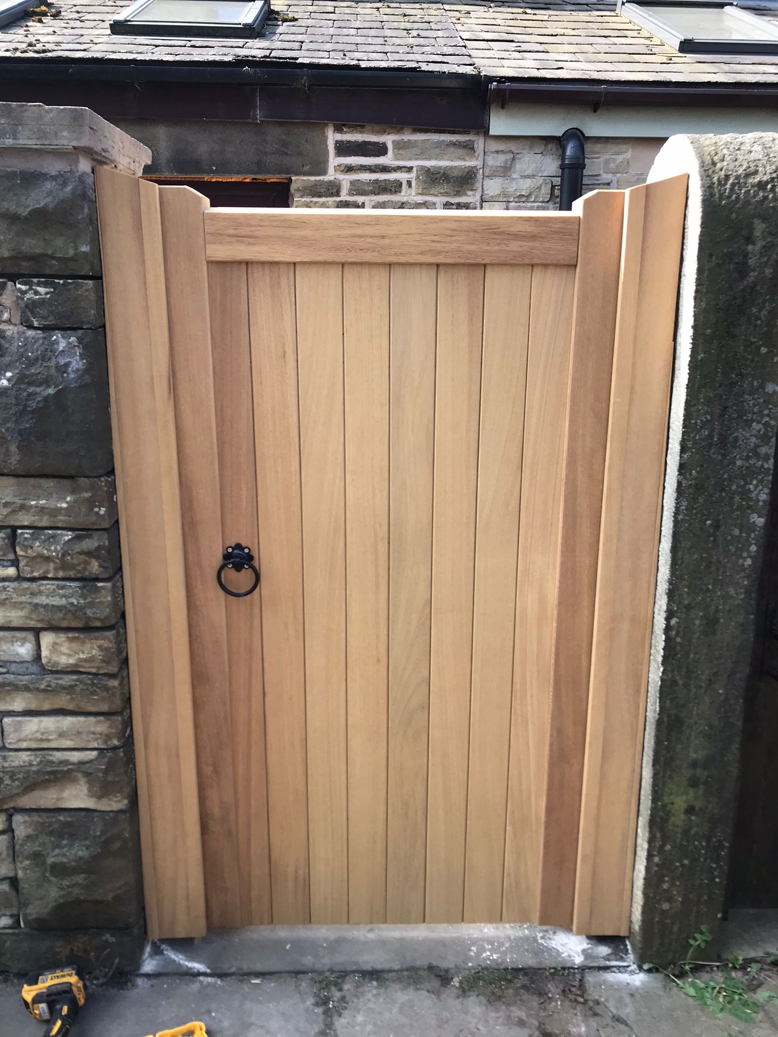 An Iroko hardwood single gate in a village design