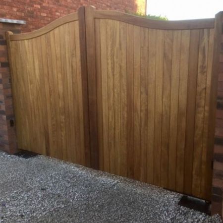 A large wooden double driveway gate