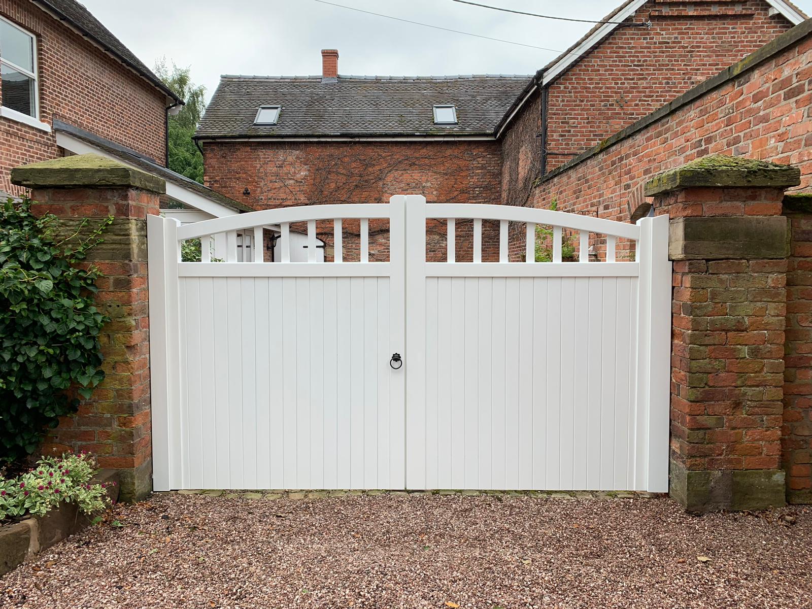 The white hardwood driveway gate