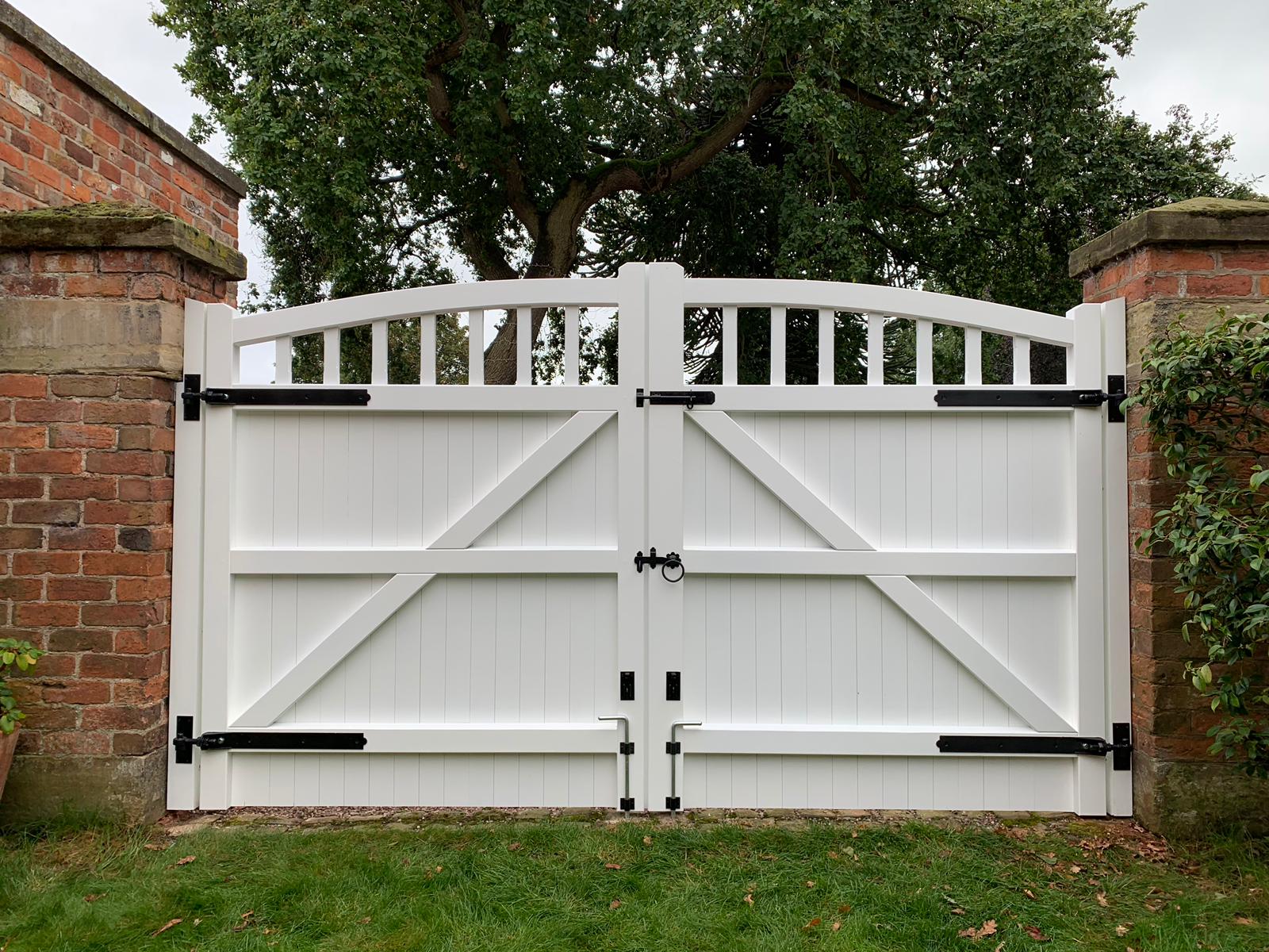 The back of a white hardwood driveway gate