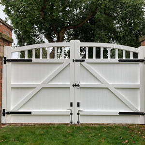 The back of a white hardwood driveway gate