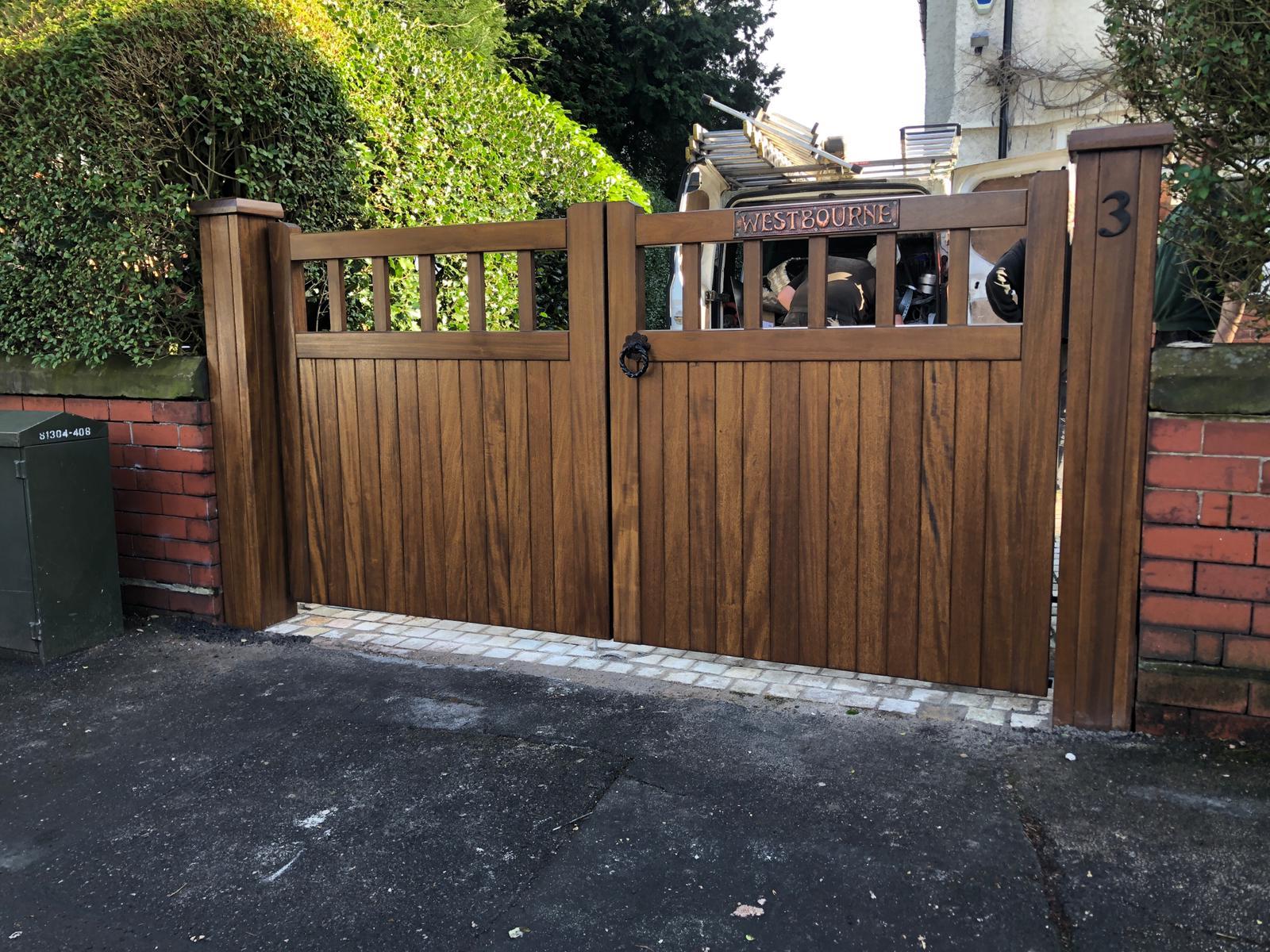 A dark oak hardwood double gate in a Cheshire design