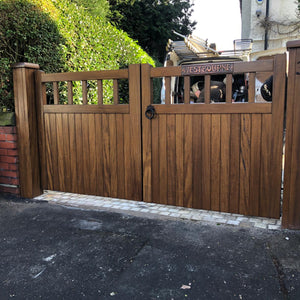 A dark oak hardwood double gate in a Cheshire design