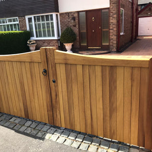 An Idbigo hardwood mid-oak double gate in a Stockton design