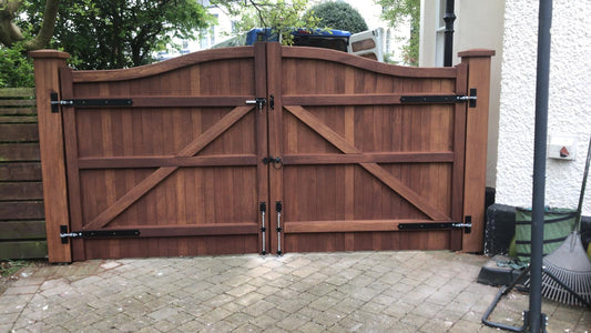 The back of an Iroko hardwood double gate with a Swan Neck design